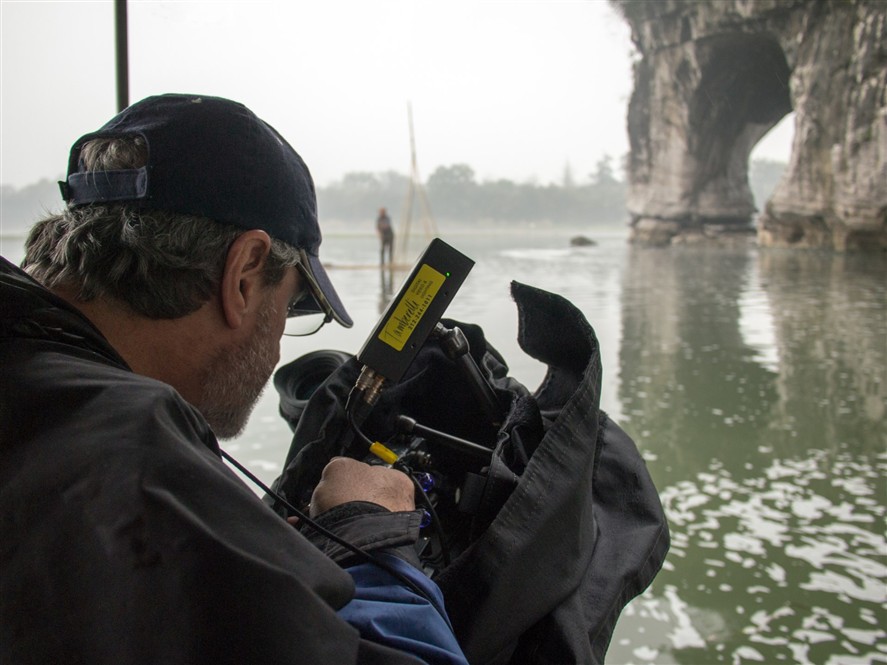 Professional camera crew filming on location