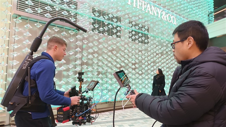 Production team coordinating a Beijing shoot on location